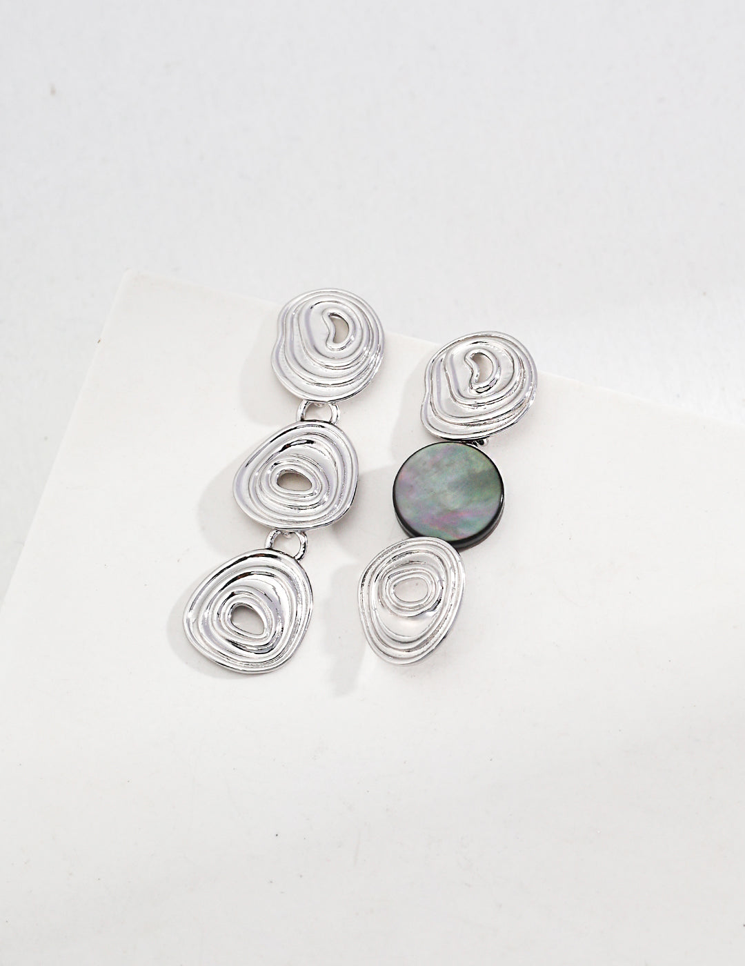 Gold asymmetrical earrings with shell drop – modern sculptural design by Twiggy Jewelry.